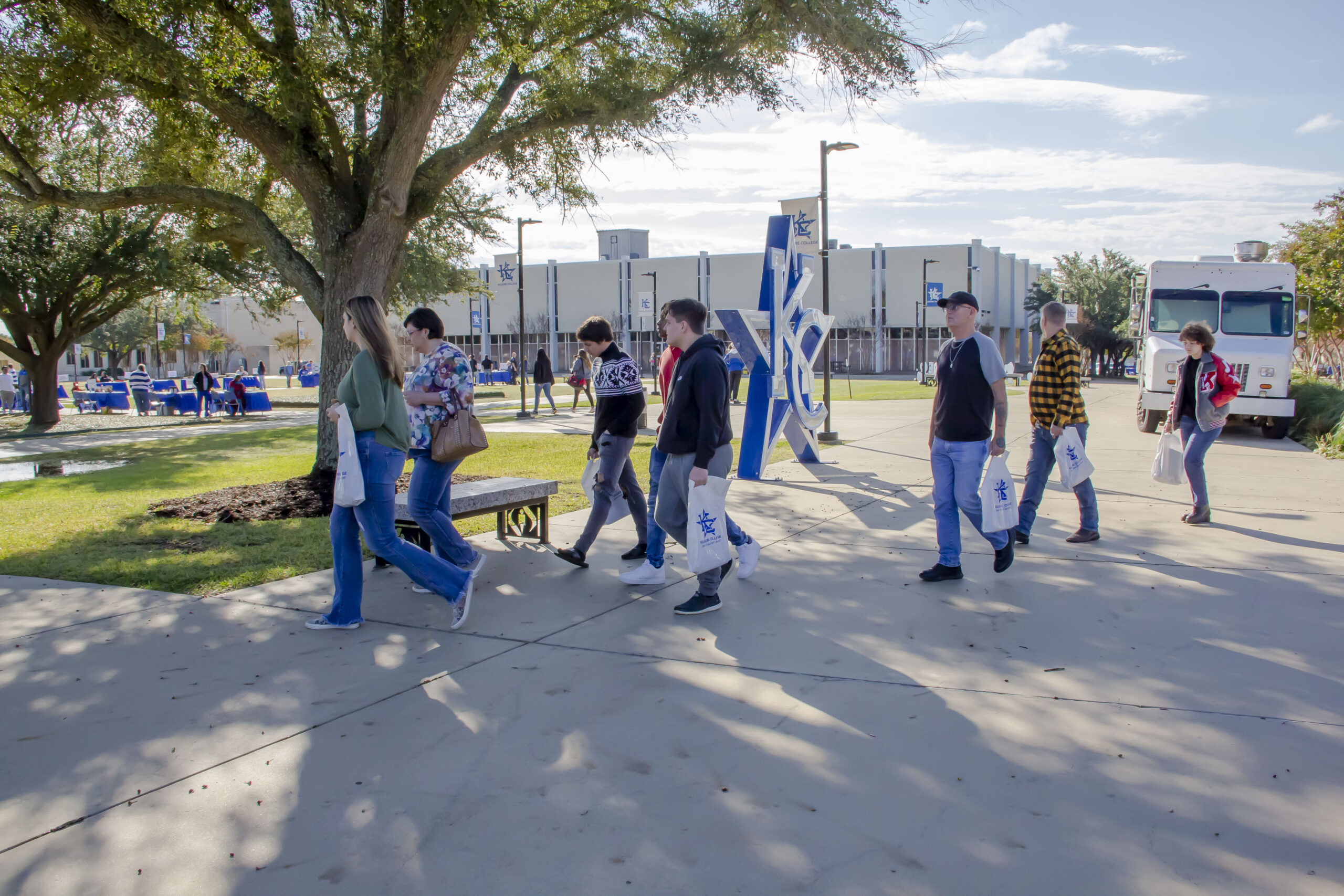 Students and parents walking around the campus at Kilgore College