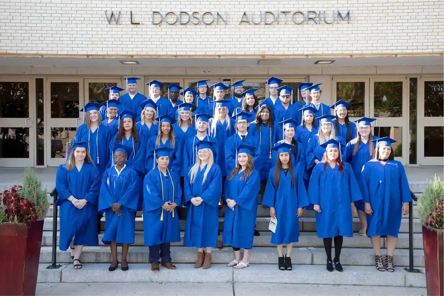 Graduating in blue robes from Kilgore College